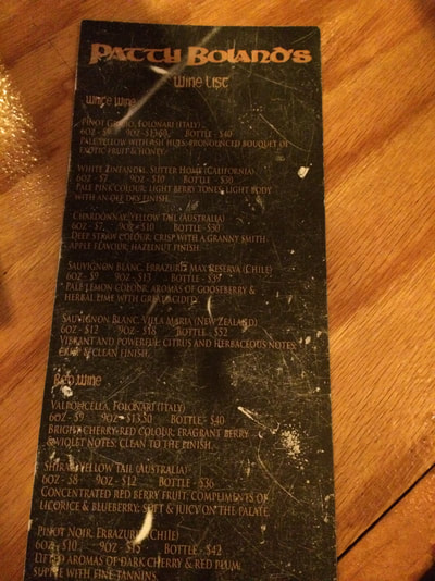 Image shows menus with copper coloured text on black background.