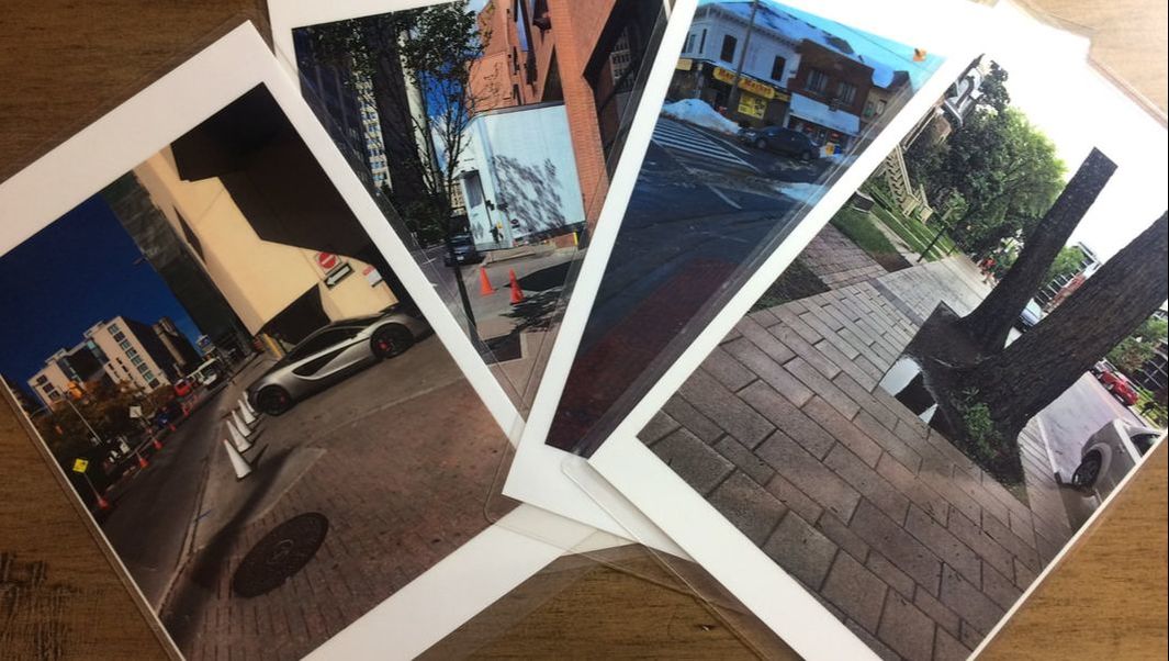 Several cards containing photos of various street scenes with obstacles to movement on a sidewalk.